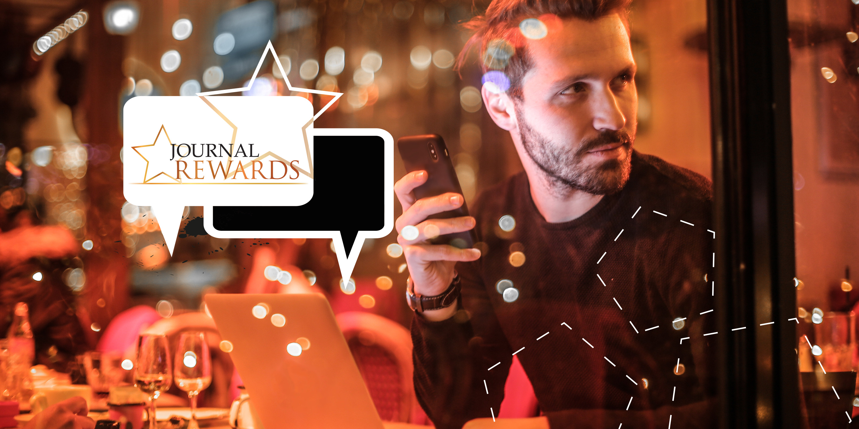 A man using the Journal Rewards app on his phone